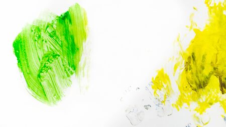 Color Paint. smears of colorful paint on the wall, traces of children's creativity on a white background. paint textureの写真素材