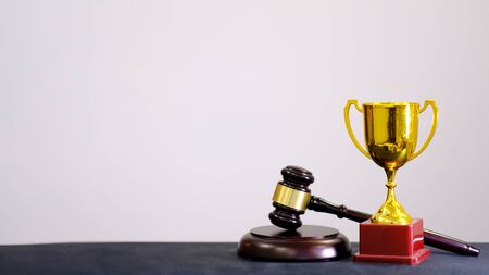 Judge's gavel on white background. Symbol for jurisdiction. Law concept a wooden judges gavel on table in a courtroom or law enforcement officeの写真素材