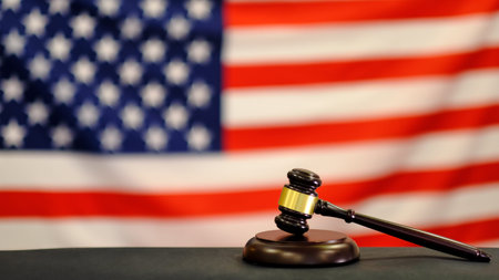 Judge's gavel and over USA flag. Symbol for jurisdiction. Law concept a wooden judges gavel on table...