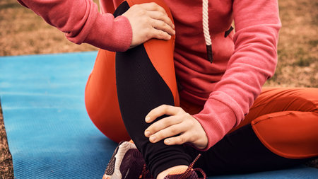 woman runner sports injured leg