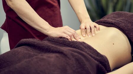 Treatment massage for weight loss in spa salon. Massage back for woman. Spa massage for correction figureの写真素材
