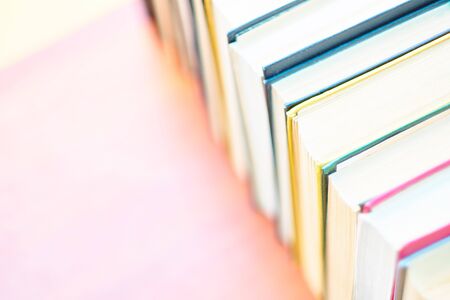 pile of old books lie on the table. home library. concept of vacation from gadgets in natureの写真素材