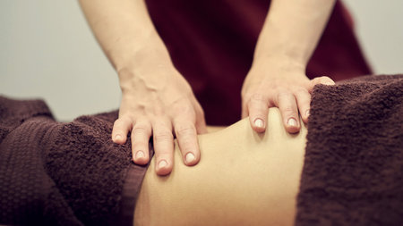 Treatment massage for weight loss in spa salon. Massage back for woman. Spa massage for correction...