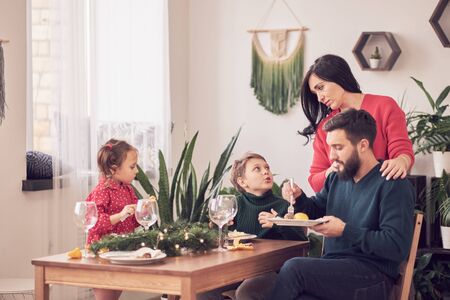 Family Together Christmas Celebration Concept. Family Enjoying christmas dinner backgroundの写真素材