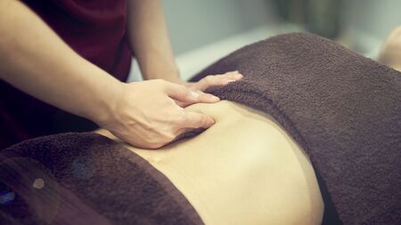 Treatment massage for weight loss in spa salon. Massage back for woman. Spa massage for correction figure.の写真素材