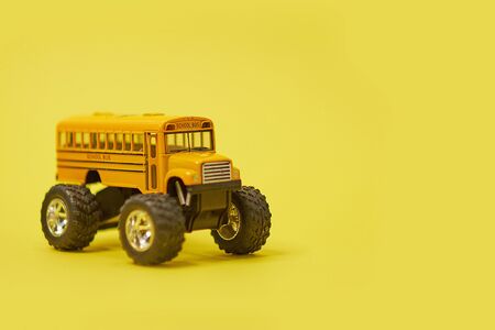 Yellow School Bus on big wheels. Transfer to school To study Safe, Soft focus and blur. And vintage style. Monster truck.の写真素材
