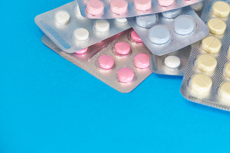 Ñcolorful antibacterials pills on white background. capsule pill medicine