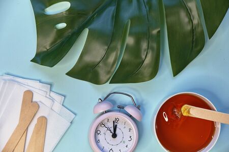 set of means of hair removal on a blue background. Wax strips. Minimalism, choice. top view, flatlay photoの写真素材