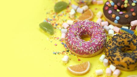 A lot of colorful candy. Tasty appetizing Party Accessories Happy Birthday Sweet Treat Swirl Candy Lollypop on Bright Background Flat Layの写真素材