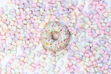 donut in a round marshmallow frame on a white background. top view photo.の写真素材
