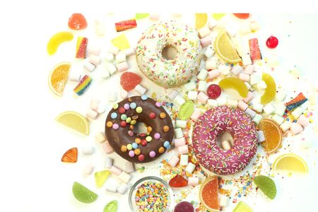 A lot of colorful candy. Tasty appetizing Party Accessories Happy Birthday Sweet Treat Swirl Candy Lollypop on Bright Background Flat Lay isolated on white backgroundの写真素材