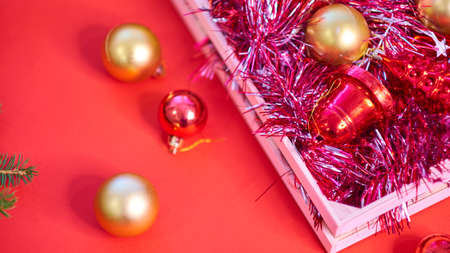 Christmas background with xmas tree on red canvas background. Merry christmas card. Winter holiday theme. Happy New Year. Space for text. christmas backdrop top view. Flat lay.の写真素材