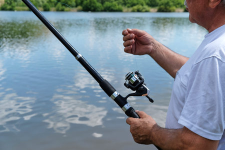 Fishing in river.A fisherman with a fishing rod on the river bank.