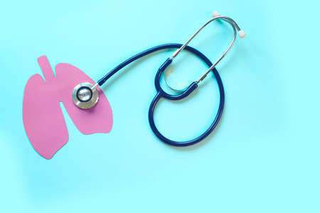 Lung health therapy medical concept . silhouette of the lungs and a stethoscope on a blue background. concept of respiratory disease, pneumonia, tuberculosis, bronchitis, asthma, lung abscessの写真素材