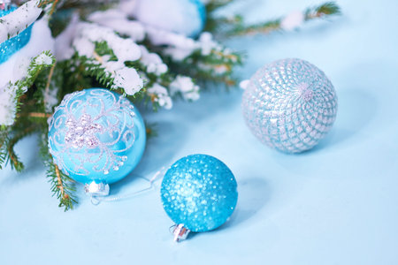 Closeup of Christmas tree with light, snow flake. Christmas and New Year holiday background. vintage...