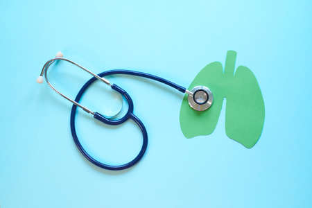 Lung health therapy medical concept . silhouette of the lungs and a stethoscope on a blue background. concept of respiratory disease, pneumonia, tuberculosis, bronchitis, asthma, lung abscessの写真素材