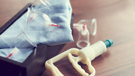 Vacuum therapy. Cup massage. Hijama. traditional Chinese medicine clinic indoor. medical and health concept.の写真素材