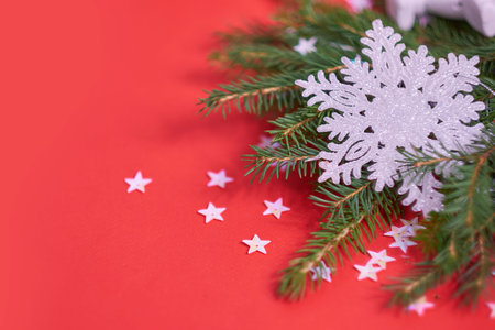 Christmas banner. Xmas design red christmas tree decorations and glitter silver confetti on a red...