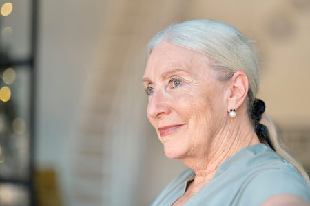 smiling senior woman. Close up facial portrait of a beautiful senior woman with a warm friendly...