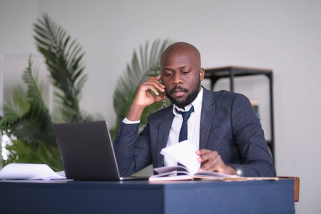 angry young African American businessman. Entrepreneur angry and furious with a laptop in a little...