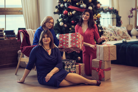 Family moments at Christmas time. concept of a fun pastime of different generations. presentation of giftsの写真素材