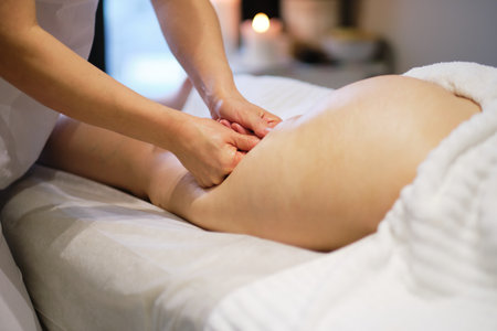masseur makes anticellulite massage young woman in the spa salon. Body care concept. Special anticellulite treatment.の写真素材