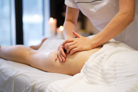 masseur makes anticellulite massage young woman in the spa salon. Body care concept. Special anticellulite treatment.の写真素材