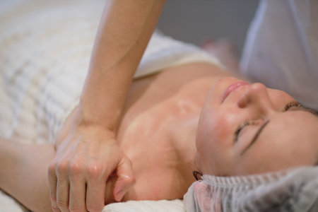 Beautiful girl has a facial massage in a beauty clinic. skin care, spa concept, treatment. Face...