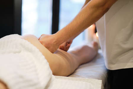 masseur makes anticellulite massage young woman in the spa salon. Body care concept. Special anticellulite treatment.の写真素材