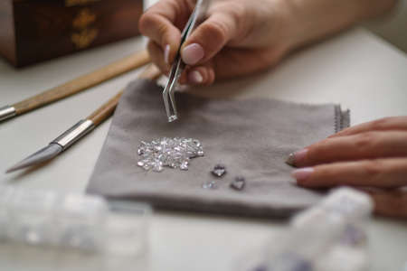 Craft jewelery making with professional tools. A handmade jeweler process, manufacture of jewellery.の写真素材