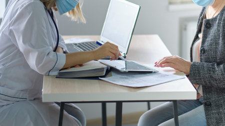Female professional doctor showing medical test result explaining prescription using digital tablet...