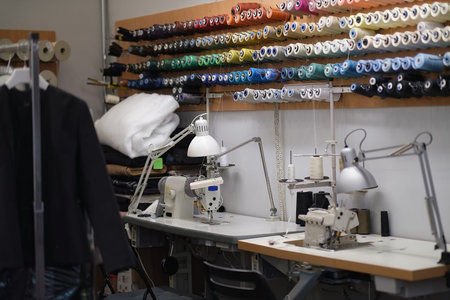 Shot of seamstress workplace. Fashion Design Studio. Sewing Machine and Various Sewing Related Items...