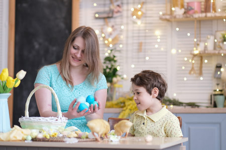 Mother and son having fun together and celebrating feast. family getting ready for easter. Little...