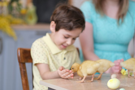 Mother and son having fun together and celebrating feast. family getting ready for easter. Little...