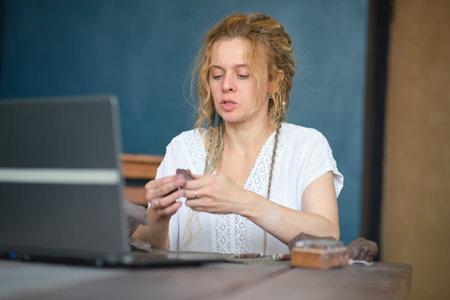 artisan pottery tutor in art studio. woman ceramist teaches an online lesson or leads a video master...