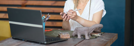 artisan pottery tutor in art studio. woman ceramist teaches an online lesson or leads a video master...