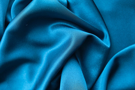 Blue silk drapery and upholstery fabric from the courtyard. Blue satin, silky fabric, wave,...