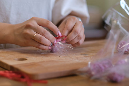 woman entrepreneur packs the order in a beautiful box, perfect service for customers.