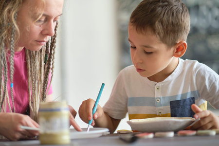 workshop for kids. Children learning how to use clay for making beautiful dishes. Workshop, master...