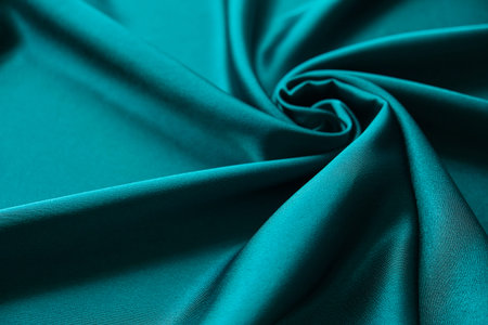Blue silk drapery and upholstery fabric from the courtyard. Blue satin, silky fabric, wave,...