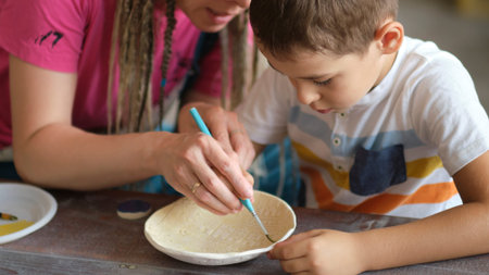 workshop for kids. Children learning how to use clay for making beautiful dishes. Workshop, master...