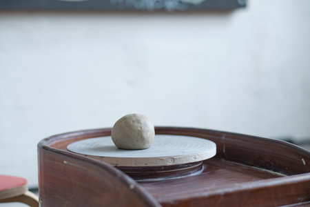 studio detail of a potters wheel with cooked clay. workshop on the creation of clay dishes.の写真素材