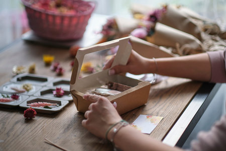 small business owner, online marketing packaging box and delivery. A parcel wrapped in brown paper....