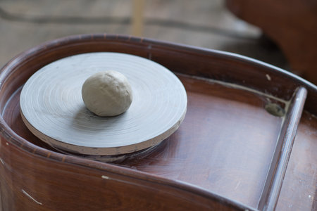 studio detail of a potters wheel with cooked clay. workshop on the creation of clay dishes.の写真素材