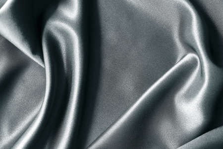 abstract texture of draped Gray background. eautiful textile backdrop. Close-up. Top viewの写真素材