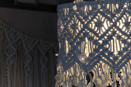 handmade macrame lampshades hanging open design in natural colours. boho style shell shade For a lamp.の写真素材