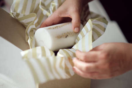 small business owner, online marketing packaging box and delivery. A parcel wrapped in brown paper. Delivery concept for private companies delivery with care. Craft present boxの写真素材