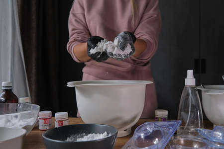 handmade bath bombs process. Preparation of bath bombs. Ingredients and floral decor on a wooden vintage table.の写真素材