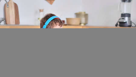 Smart boy student listen to online lesson on tablet wear headphones Spbas. Homeschooled child watch.の写真素材