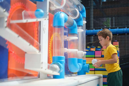 fascinating physics with a labyrinth of pipes. By doing the experiments, the child will gain practical skills and understand that learning is fun.の写真素材
